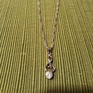 Treble clef necklace with glass stone